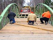 Picture of MCDOT crew laying planks.