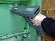 Picture of lead level in paint being determined by an XRF device.