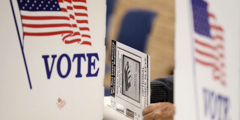 Image of person casting vote