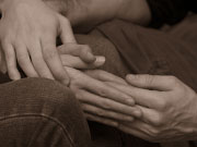 Picture of hands holding each other in support.