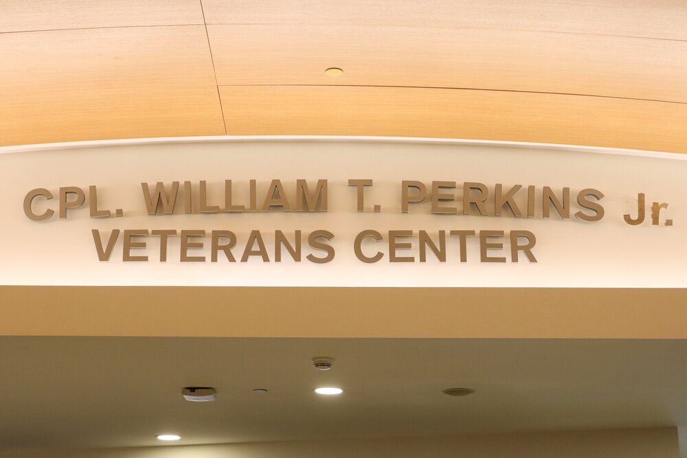 Sign reading "CPL. William T. Perkins Jr. Veterans Center"