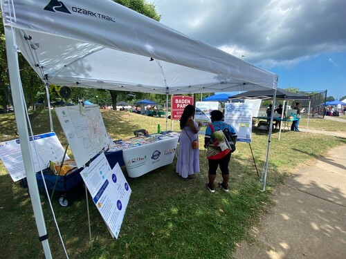 Photo of Jordan Health Festival Vendor Tent with 2 people in it