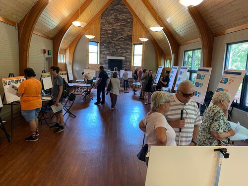 Photo of people looking at a poster exhibition