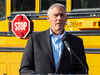 Adam Bello in Front of School Bus